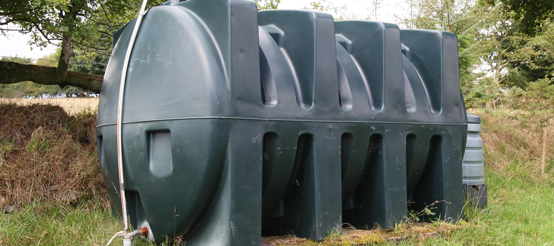 heating oil storage tank in garden of rural property